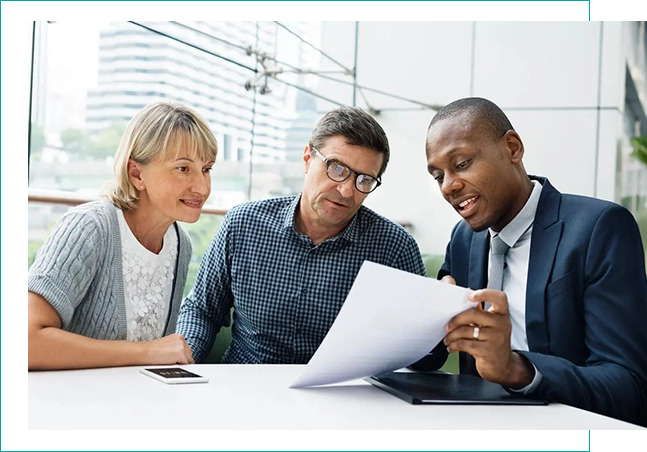 People discussing data on a table. People discussing data on a table.