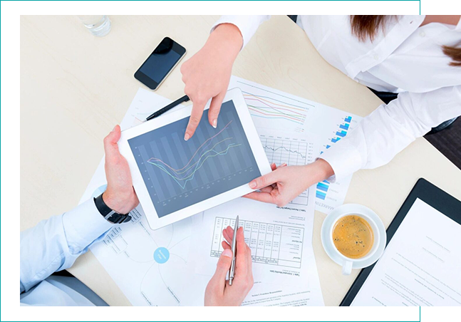 People discussing data on a tablet.